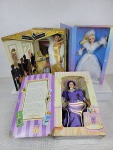 lot 736 image: Set of (3) Barbie Dolls - 1997 Mrs. P.F.E. Albee Barbie for AVON, 2002 Hooray for Hollywood Barbie, and 2002 Winters Reflection Barbie