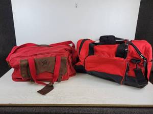 lot 904 image: Pair of Duffel Bags - Marlboro Country Store and Red PolyesterBlack Vinyl