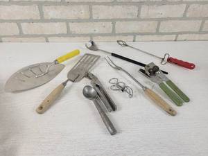 lot 550 image: Lot of Vintage Kitchen Utensils - Foley Strainer, Jar Lifter, Cherry Pitter, Meat Fork and More