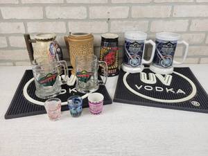 lot 576 image: Collection of Beer Steins, UV Vodka Drink Mats and More - NO SHIPPING