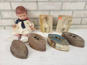 lot 584 image: Antique Irons, Vintage Baby Doll and Carved Stone Bookends - NO SHIPPING