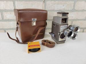 lot 835 image: Vintage Bell & Howell 252 8mm Home Movie Camera with Original Case and Roll of Film