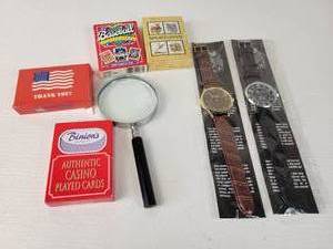 lot 843 image: (2) New in Package EIGER Watches  (4) Decks of Playing Cards