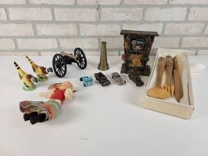 lot 928 image: Vintage Brass Hose Nozzle, Piano Player Music Box, Hand Carved Utensils, Cast Iron Cannon, Hot Wheels and More