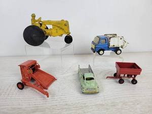 lot 953 image: Vintage Toys - Slik Minneapolis Moline Cast Aluminum Tractor, Tootsietoys Ford Pickup, Garbage Truck, and More