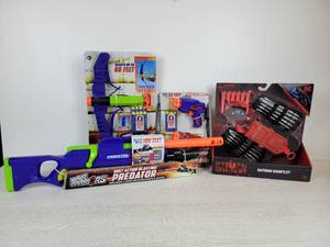 lot 986 image: Lot of (4) NEW IN BOX Toys - Air Warriors Blasters and Batman Gauntlet