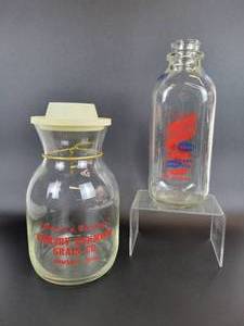 lot 1054 image: Vintage Seasons Greetings Ormsby Farmers Grain Co. Juice Pitcher and One Quart Dairyland Milk Bottle