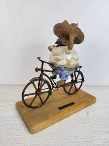 lot 1099 image: Rodo Padilla Sculpture - Man on Bicycle with Bread Basket