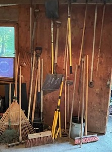 lot 95 image: Nice Assortment of Garden and Garage Tools - Brooms, Shovels, Rakes, Sledge Hammer, Pitch Forks, and More