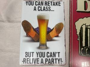 lot 43 image: Pair of Comical Metal Beer Signs