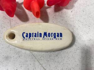 lot 111 image: Elvis Shot Glass, Captain Morgan Floating Key Chain and more