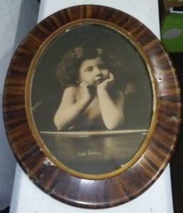 lot 403 image: Oval Framed Cupid Waiting.