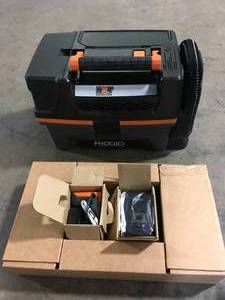 lot 39 image: RIDGID 3 Gallon 18-Volt Cordless Handheld NXT WetDry Vacuum with Battery, Charger, Fine Dust Filter, Hose and Accessories Customer Returns See Pictures