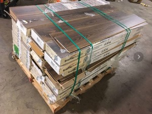 lot 54 image: Pallet of TrafficMaster Napa River Oak 7 mm T x 7.5 in. W Laminate Wood Flooring (26.8 sqftcase) (34 Boxes) Customer Returns See Pictures