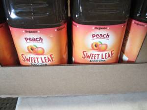 lot 465 image: 8- 64 oz bottles Peach Seet Leaf Ic...