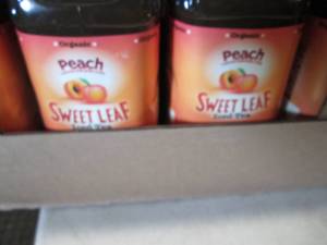 lot 466 image: 8- 64 oz bottles Peach Seet Leaf Ic...