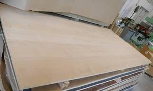 lot 35 image: One sheet of clear Alder melamine, white on the back side