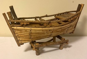 lot 83 image: Rustic Twig Canoe Figurine