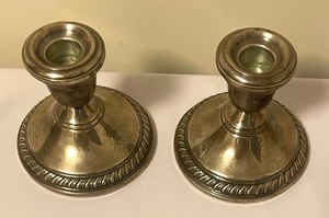 lot 103 image: Pair of Weighted Sterling Silver Candle Holders