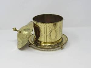 lot 23 image: Brass grouping, large brass jack, footed planters, covered container, table game