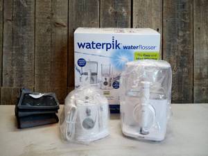 lot 91 image: Waterpik Evolution and Nano Water Flosser Combo Pack
