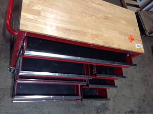 lot 1 image: Husky 42 in. W x 18.1 in. D 8-Drawer Red Mobile Workbench Cabinet with Solid Wood Top   Customer Returns See Pictures