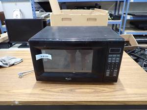 lot 52 image: Microwave  removed from working environment  will need a wipe down