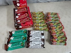 lot 141 image: Nugo Dark Protein Bars and Quaker Chewy Granola Bars