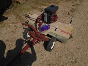 Terra Broom powered sweeper tow behind broom. 3.5 hp Briggs engine. Was used to sweep golf course greens.