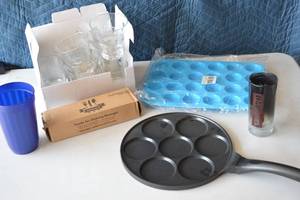 lot 25 image: Assorted Lot Kitchen Supplies Glassware, Flatware, Silicone Muffin Tray, etc.