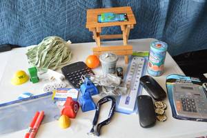 lot 29 image: Lots of new products Large print calculators, poster letters, thermometer, snake in a can filled with candies  and much more
