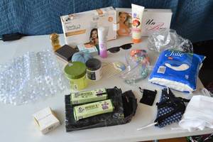 lot 41 image: Chinese skin cream, wrinkle remover, Celine Dion perfume, face masks with filters, pads, anti shrinkage cream, unbra, cpap water chamber, argan oil, tip q-tips, bracelets, jewlery boxes, pics, hair styling products, sunglasses, and more