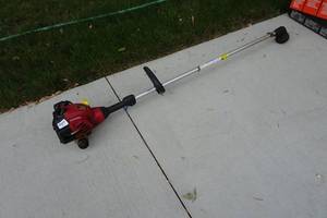 lot 242 image: Homelite Gas Straight Shaft Trimmer