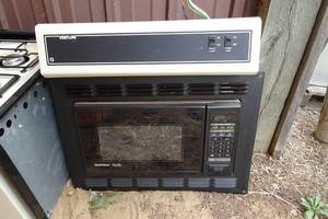 lot 255 image: RV Microwave, Stove, and Vent