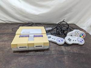 lot 11 image: Super Nintendo Entertainment System Console w 3 remotes
