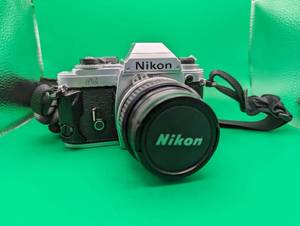 lot 168 image: Vintage Nikon FG SLR Camera w Case & Accessories