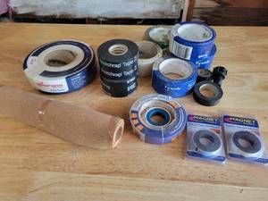 lot 202 image: Lot of Tyvek Tape, Drywall Tape, Magnetic Tape, Cork and More