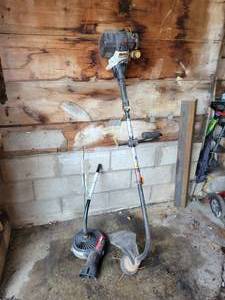 lot 17 image: RYOBI Model 825r 4-Cycle Gas Weed Trimmer with Blower Attachment - NO SHIPPING