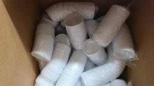 Half box full of Dixie coffee lids