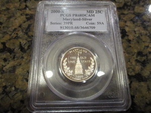 lot 16 image: 2000-S PCGS Certified 913010.683646709 PR68 Deep Cameo Maryland Silver Quarter