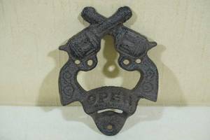 lot 81 image: Cast Iron Crossed Pistols Bottle Opener