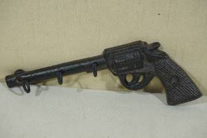 lot 82 image: Cast Iron Pistol CoatKey Rack