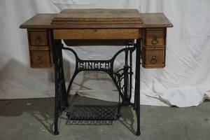 vintage Singer Sewing machine in cabinet