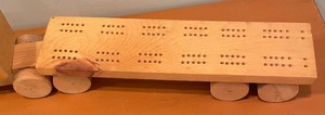 lot 152 image: Wooden Truck Motif Cribbage Board