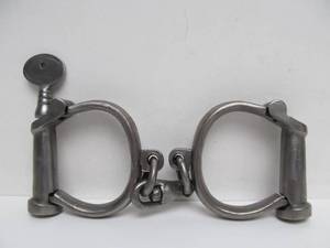 lot 37 image: Vintage Hiatt Police Handcuffs wKey
