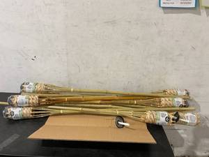 lot 103 image: Tiki Brand 12-Pack of Homespun 56 inch Weather Resistant Bamboo Torches