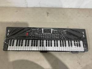 lot 314 image: 61 -Key Electronic Piano Keyboard with Built-in Dual Speakers and Music Holder