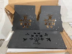 lot 68 image: Outdoor Diamond Black Cast Iron Outdoor Wood Fire Pit with Cut Out Tree Design and Fire Poker