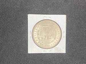 1880 Morgan Silver Dollar marked MS63 when purchased