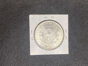 1884-O Morgan Silver Dollar marked MS65 when purchased
